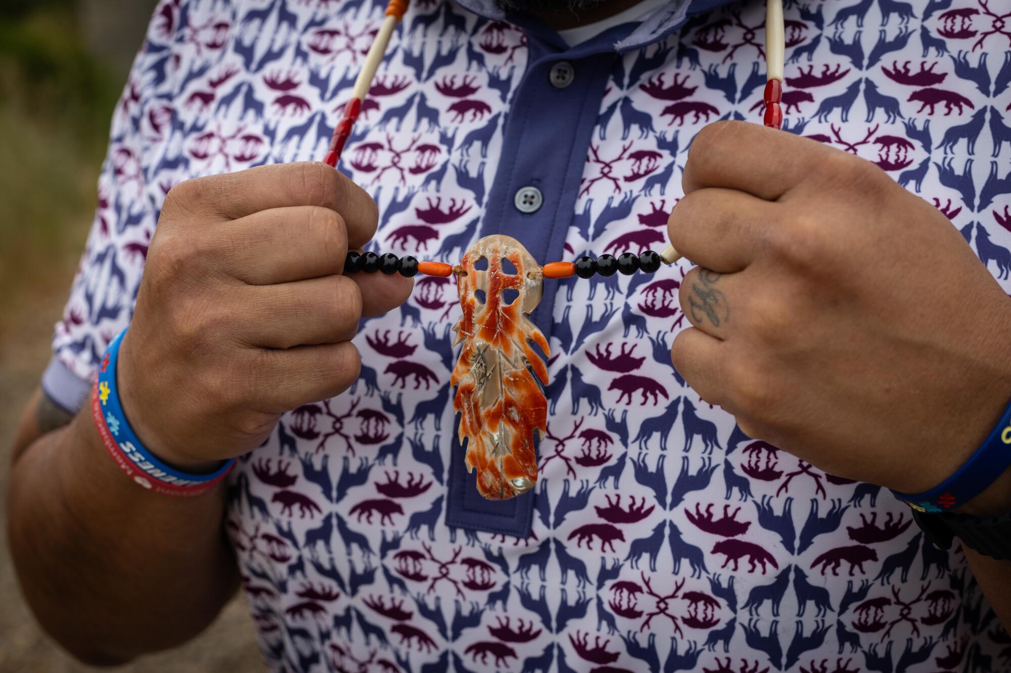 Anthony Roberts, tribal chairman of the Yocha Dehe Wintun Nation, wears Indigenous jewelry made of abalone shell.