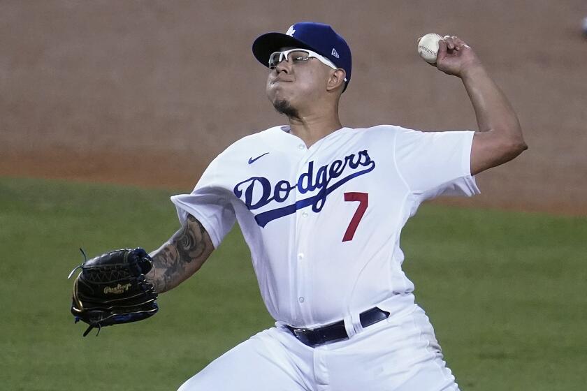 Los Angeles Dodgers reliever Julio Urias throws to an Oakland Athletics batter during the fourth inning of a baseball game Wednesday, Sept. 23, 2020, in Los Angeles. (AP Photo/Marcio Jose Sanchez)