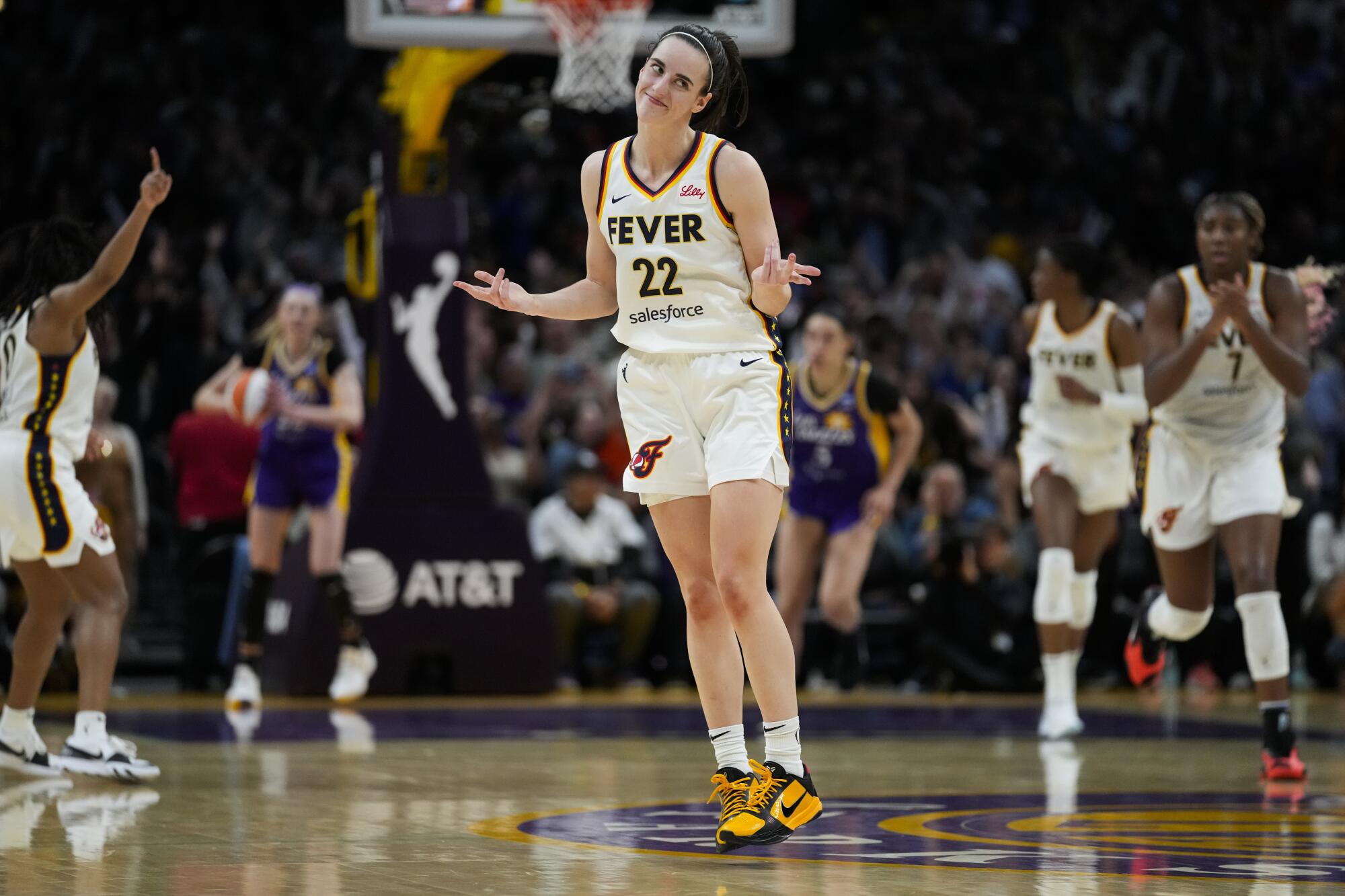 Indiana Fever guard Caitlin Clark celebrates after making a three pointer against the Sparks in Los Angeles Friday.