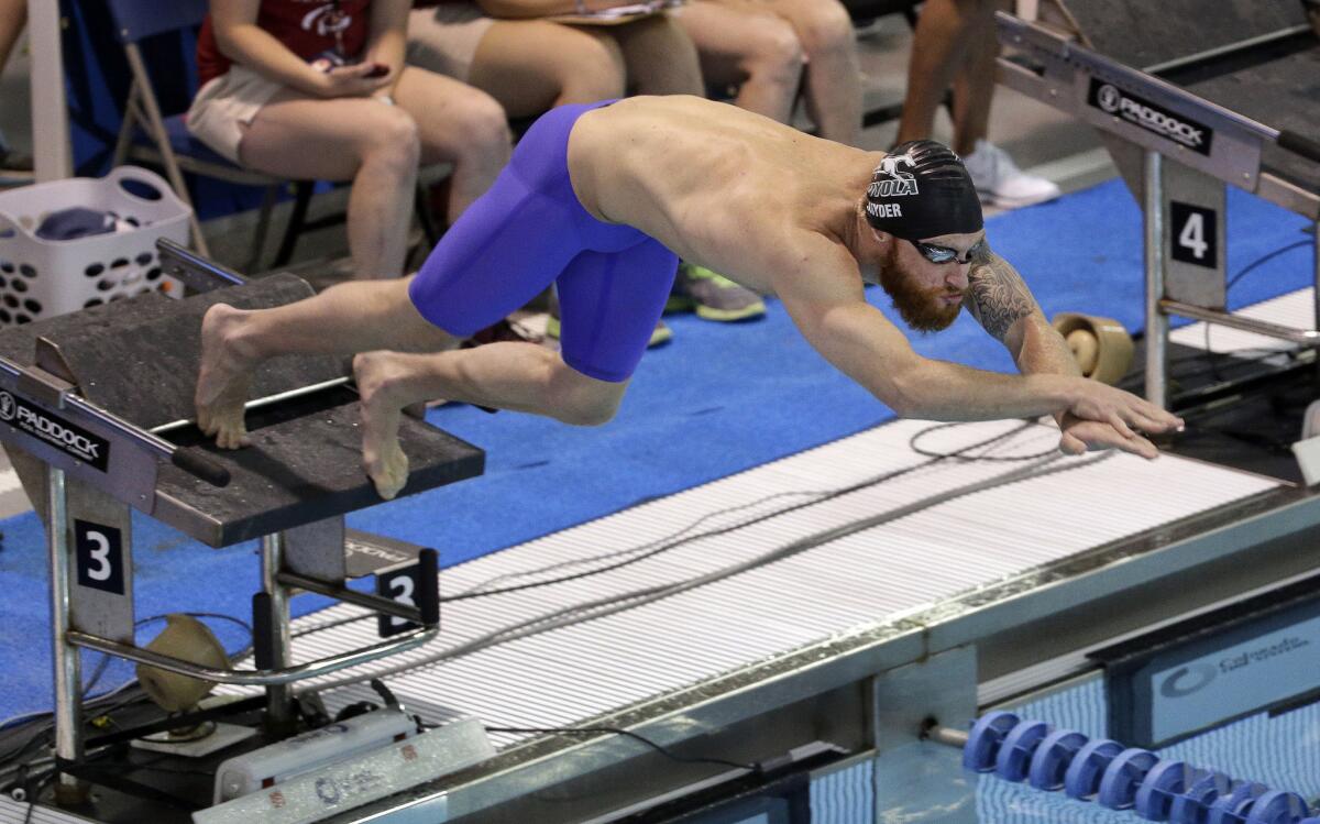 Brad Snyder dives into the pool at the start of a 400-meter freestyle race at the U.S. Paralympic trials last month.