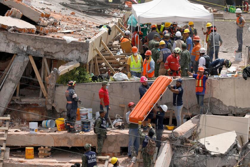 MEXICO CITY, -- WEDNESDAY, SEPTEMBER 20, 2017: Rescue teams continue searching for students trapped in the rubble at Enrique Rebsamen School in Colonia Nueva Oriental Coapa, in Mexico City, on Sept. 20, 2017. A powerful 7.1 earthquake rocked central Mexico on Tuesday, collapsing homes and bridges across hundreds of miles, killing at least 225 people. (Gary Coronado / Los Angeles Times)