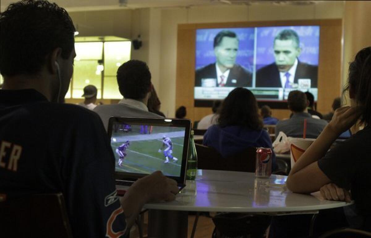 Students at UCLA's Ackerman Student Union watch the last presidential debate. This year's general election presidential debates have drawn bigger audiences than those in 2008.
