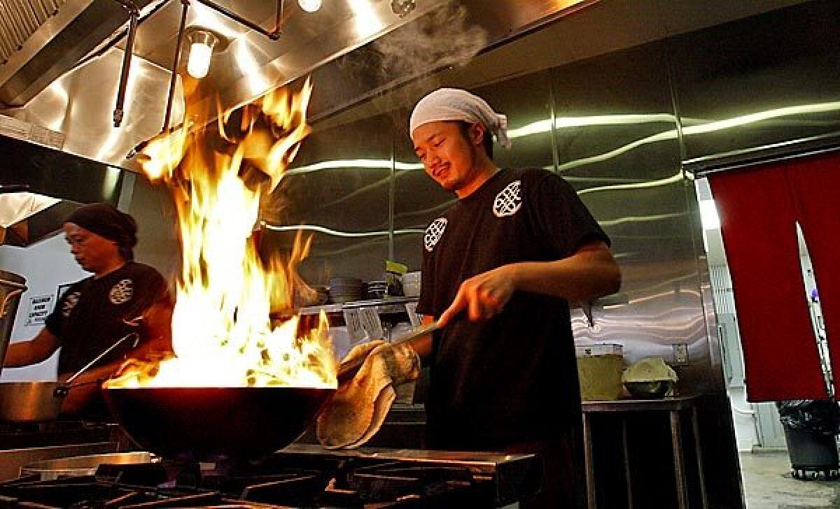 Chief Executive Chef Natsuki Ishijima prepares a bowl of ramen at Mottainai ramen restaurant in Gardena.