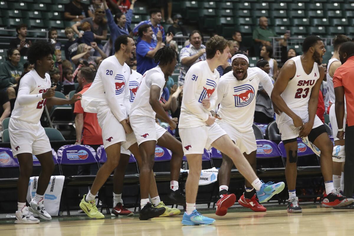 The Southern Methodist bench reacts to a play against Iona on Dec. 22, 2022, in Honolulu.