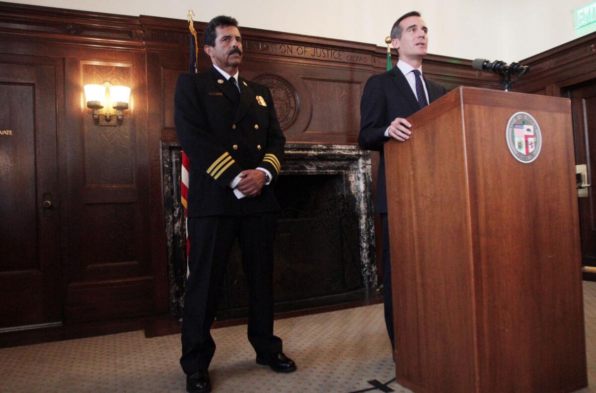Los Angeles Mayor Eric Garcetti, right, named Ralph M. Terrazas to be the next permanent head of the Los Angeles Fire Department.