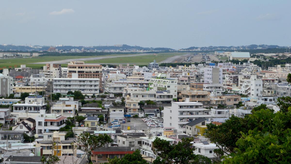 Marine Corps Air Station Futenma, which sits in the middle of a dense urban area, is slated to be closed and its functions relocated elsewhere on Okinawa. But opposition to the new facility has stalled the move.