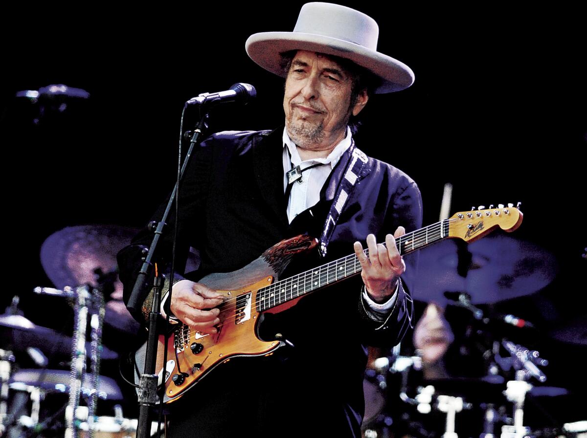 A 2012 file photo shows Bob Dylan performing in France. Dylan refused to allow photographs at his show Saturday with Mavis Staples at the Santa Barbara Bowl, part of a tour that reaches the Shrine Auditorium in Los Angeles on Thursday.