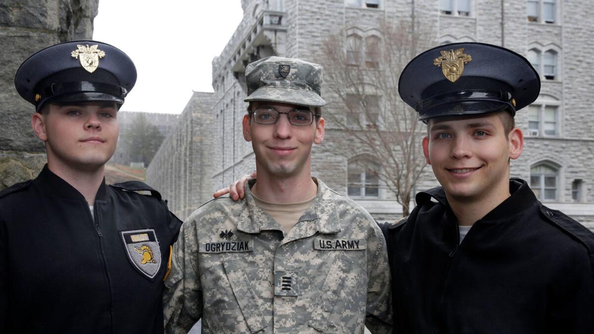 Twins Cole, left, and Sumner Ogrydziak, right, with brother Noah Ogrydziak at the U.S. Military Academy in West Point, N.Y.