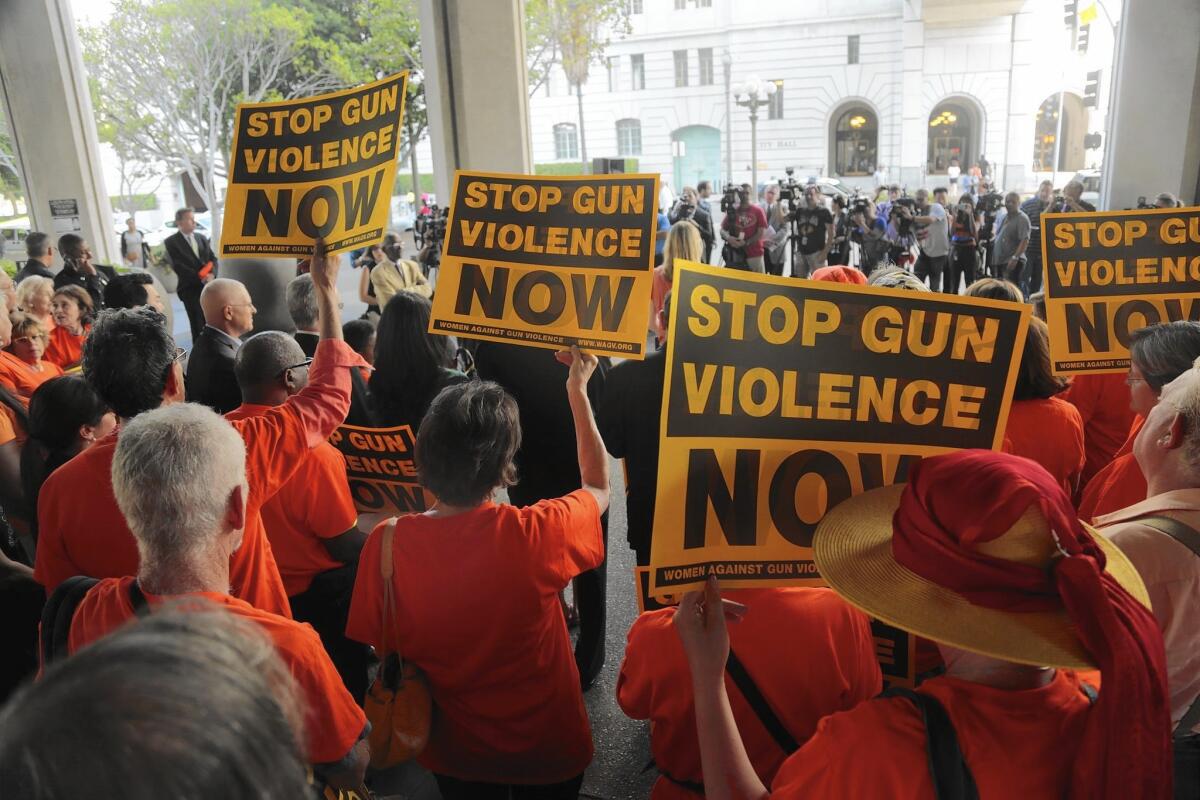 Gun-control activists gather in front of Los Angeles City Hall for a rally before the July 28 vote to ban magazines with a capacity of more than 10 rounds.
