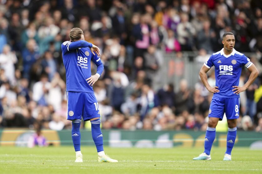 Leicester's James Maddison, left, and Youri Tielemans stand dejected during the English Premier League soccer match between Fulham and Leicester City at Craven Cottage, London, Monday, May 8, 2023. (Zac Goodwin/PA via AP)
