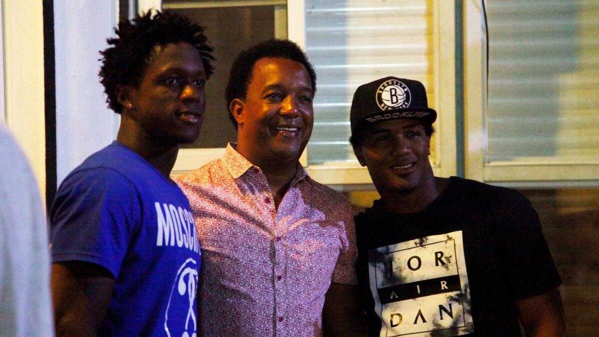 MLB Hall of Famer Pedro Martinez, center, stopped by the home of friend Moises Alou on Jan. 31 during a team dinner in Santo Domingo, Dominican Republic.