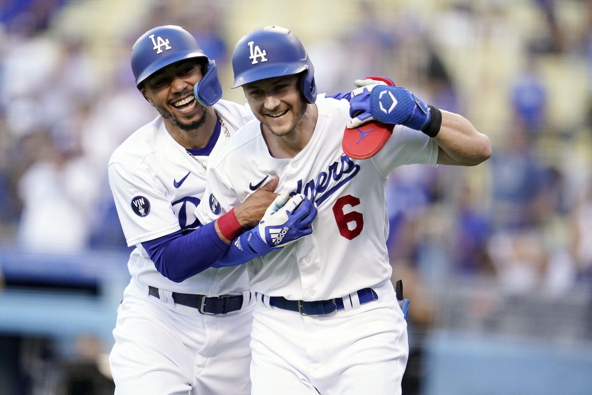 Trea Turner celebrates with Dodgers teammate Mookie Betts after hitting a two-run home run