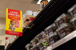 Signs advertising low prices are posted at Ralphs.