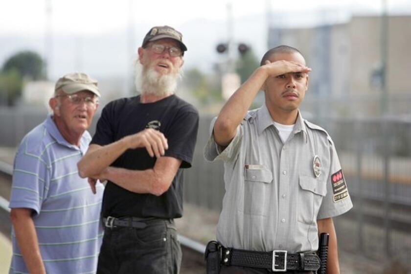 Bob Atkinson, Chris Cassel and Chris Watson, from left, say the Metrolink train didn't run a red light. "I saw the light was green. Everything seemed all right," Watson said.