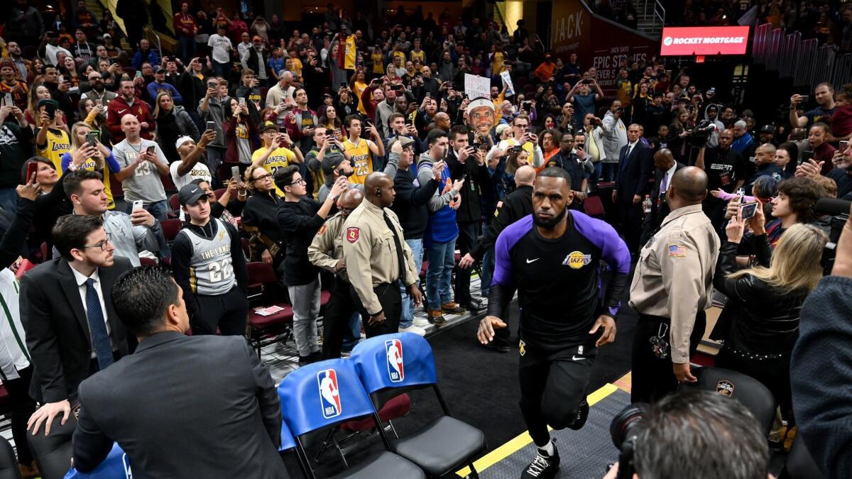 LeBron James runs on to the court prior to the game against the Cleveland Cavaliers at Quicken Loans Arena.