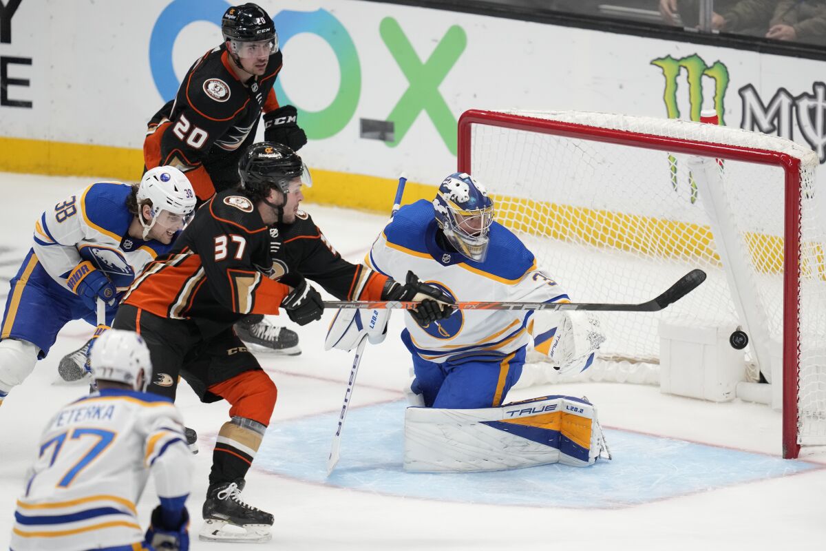 Ducks center Mason McTavish shoots against Buffalo Sabres goaltender Eric Comrie.
