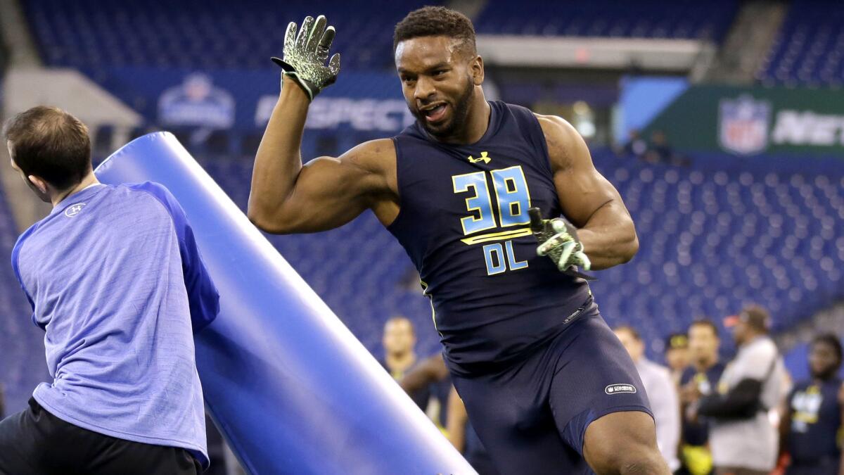 Pittsburgh defensive end Ejuan Price runs a drill at the NFL combine in March.