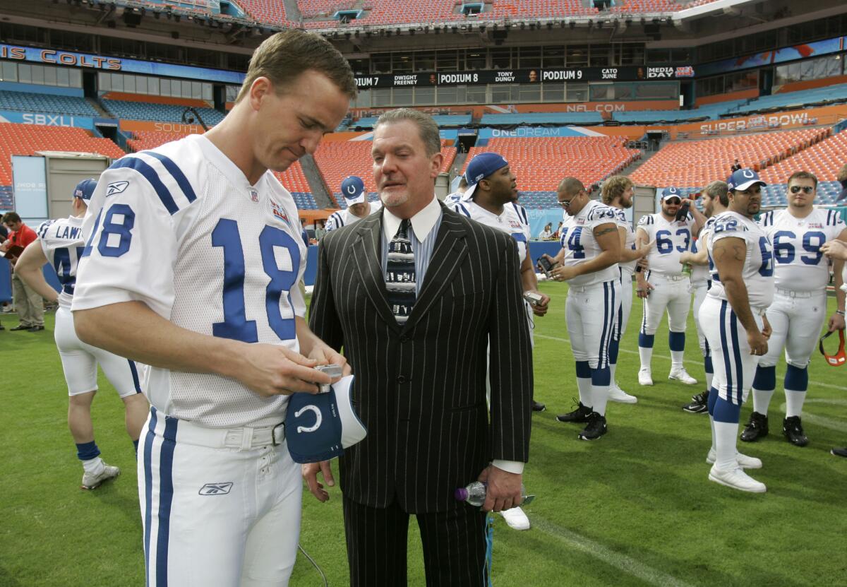 Indianapolis quarterback Peyton Manning, left, chats with Colts owner Jim Irsay on Jan. 30, 2007.