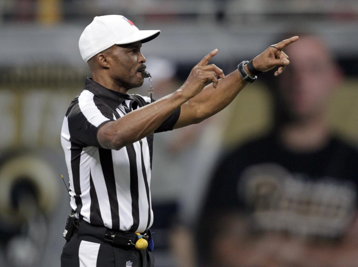 Referee Mike Carey makes a call 