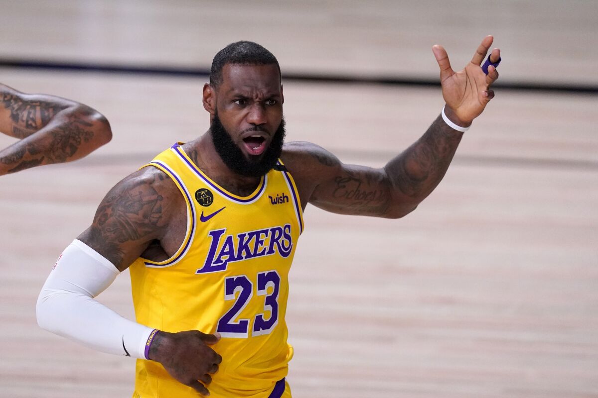 LeBron James shouts toward an official during the first half of the Lakers' win over the Denver Nuggets.