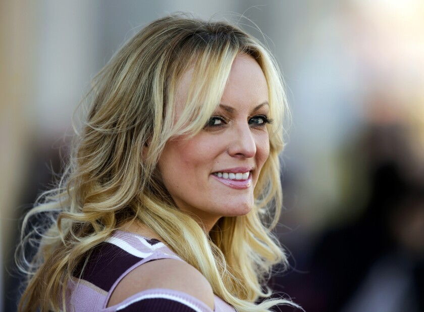 FILE - In this Oct. 11, 2018, file photo, adult film actress Stormy Daniels attends the opening of the adult entertainment fair "Venus," in Berlin. When Donald Trump left the White House in January 2021, he remained "Individual-1" in the federal campaign finance crimes case against his former attorney, Michael Cohen. The prosecution stemmed from six-figure payments Cohen arranged to Daniels and former Playboy model Karen McDougal, to keep them quiet during the campaign about alleged affairs with Trump. (AP Photo/Markus Schreiber, File)