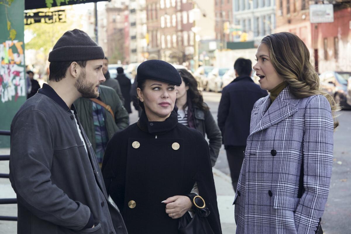 Sutton Foster looks surprised as she talks with Nico Tortorella's and Debi Mazar's characters on a New York street.