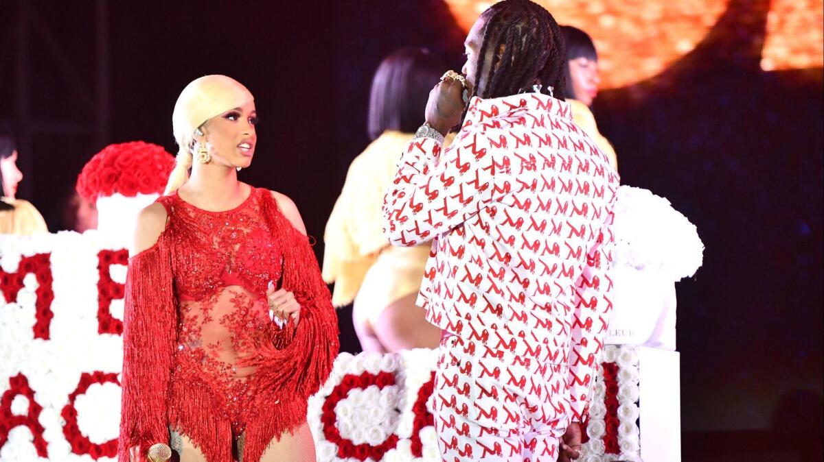 Offset, right, is defending his actions after interrupting estranged wife Cardi B's set at Rolling Loud over the weekend.