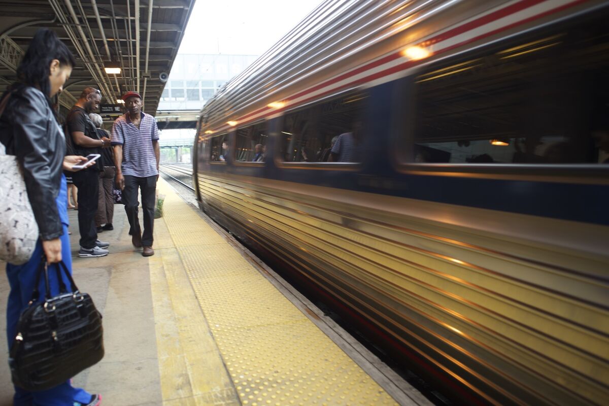 An Amtrak train heading to New York departs Trenton, N.J., on Monday.
