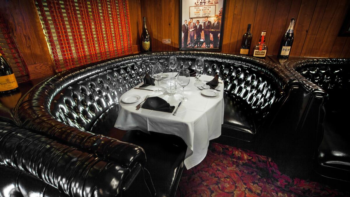 Booth No. 22 at the Golden Steer restaurant in Las Vegas now appears much the same as it did when it was Frank Sinatra's personal table during the 1960s. During December, diners can enjoy a special menu while seated in the booth.
