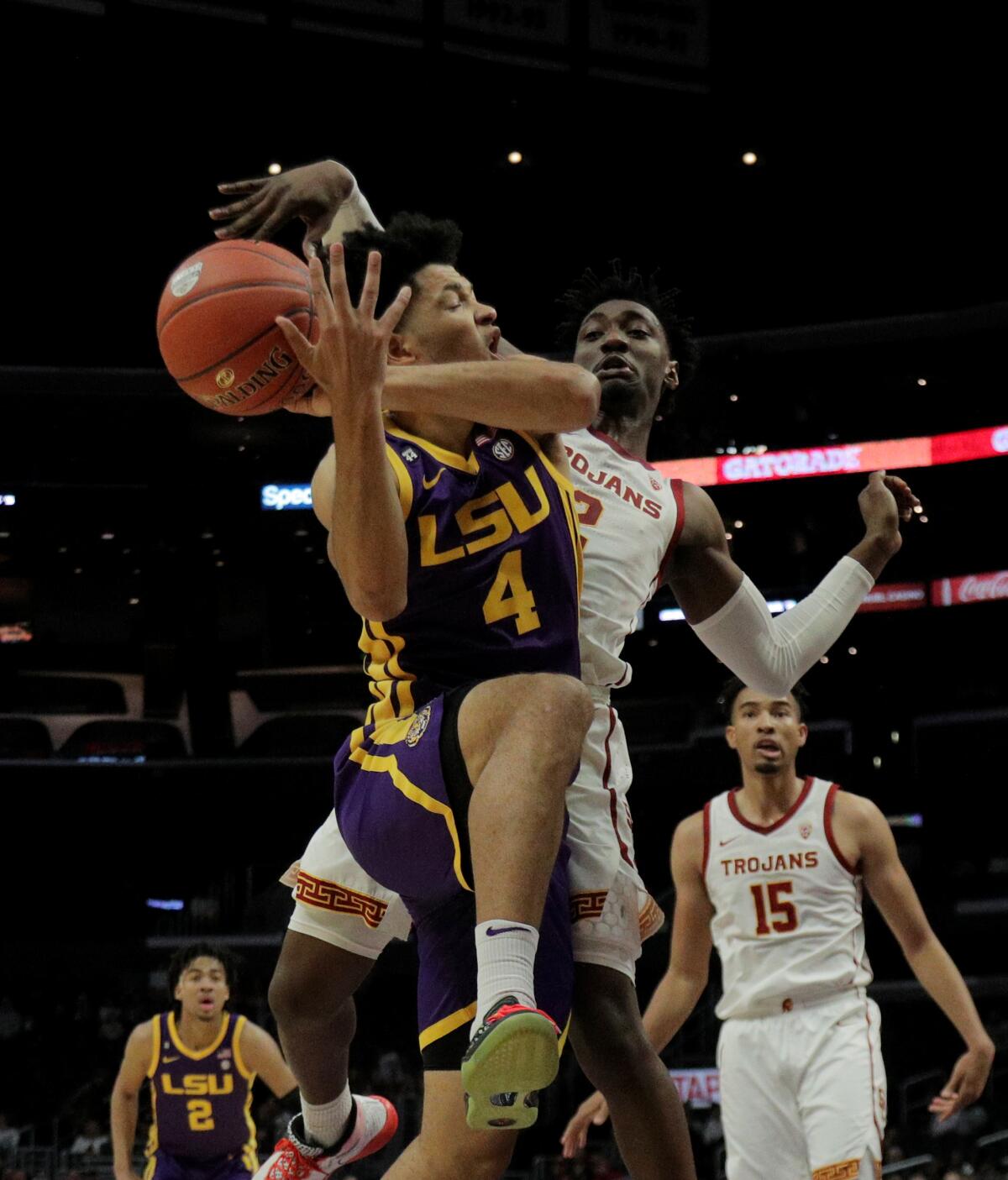 USC guard Jonah Mathews strips the ball from LSU guard Skylar Mays during the first half of a game on Dec. 21, 2019, at Staples Center.