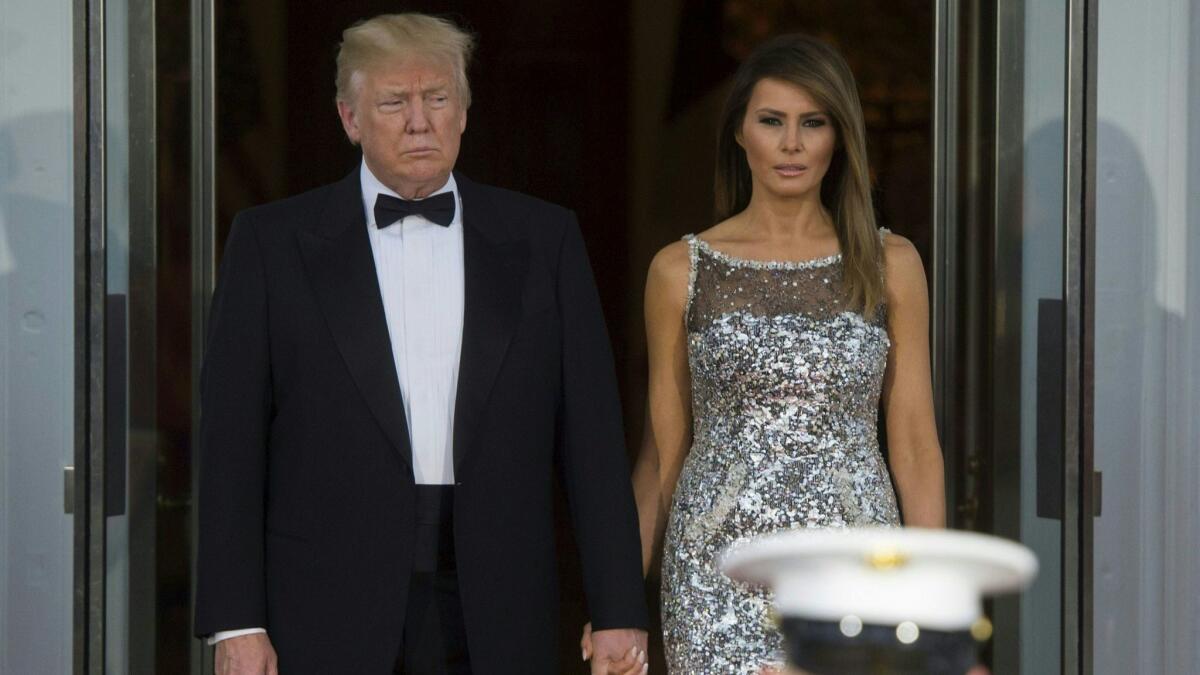 President Trump and First Lady Melania Trump step out to welcome French President Emmanuel Macron and his wife, Brigitte Macron, at the White House on April 24.