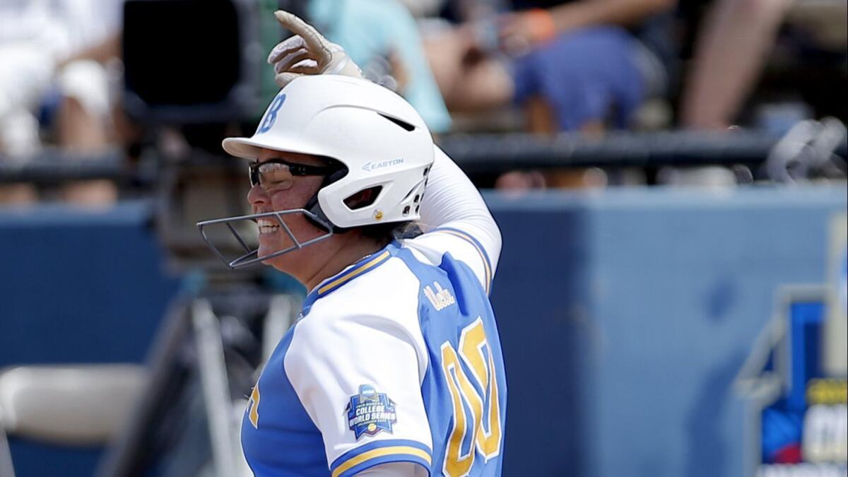 UCLA's Rachel Garcia celebrates her three-run home run in the 10th inning against Washington in the Women's College World Series semifinals on June 2.