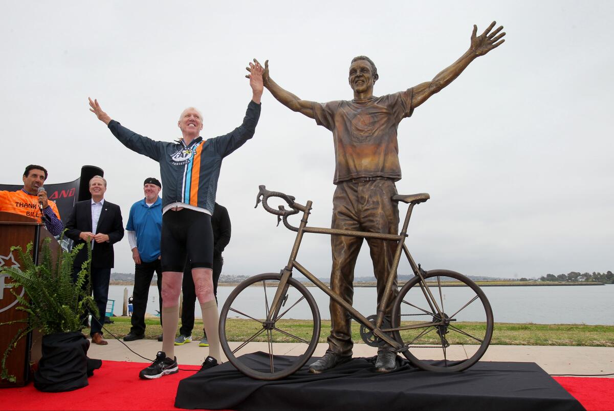 In 2016, Bill Walton stands with a new bronze statue depicting him during its unveiling at Mission Bay's Ski Beach.