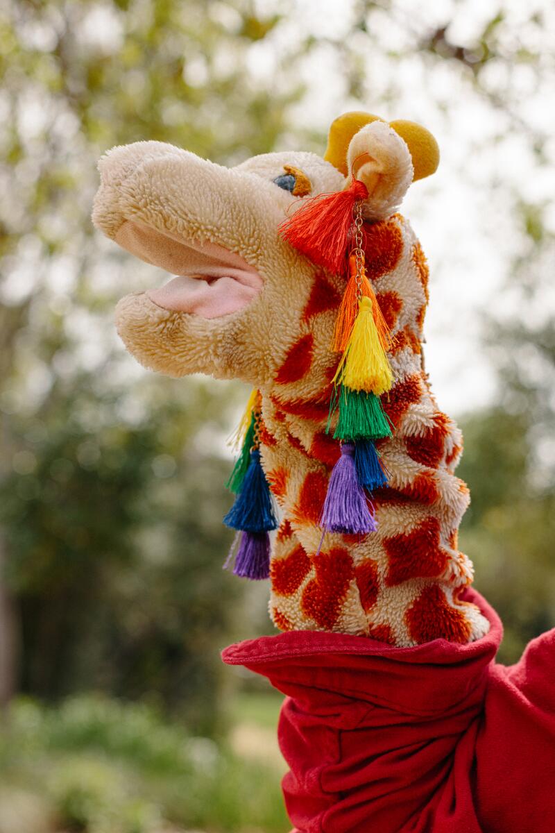 A giraffe puppet.