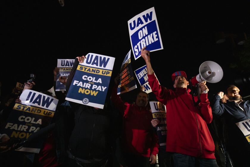 WAYNE, MICHIGAN - SEPTEMBER 15: Supporters and workers cheer as United Auto Workers members go on strike at the Ford Michigan Assembly Plant on September 15, 2023 in Wayne, Michigan. Contract negotiations with the Big Three auto makers Ford, General Motors, and Stellantis expired at 11:59pm September 14. This is the first time in history that the UAW is striking all three of the Big Three auto makers at the same time. (Photo by Bill Pugliano/Getty Images)
