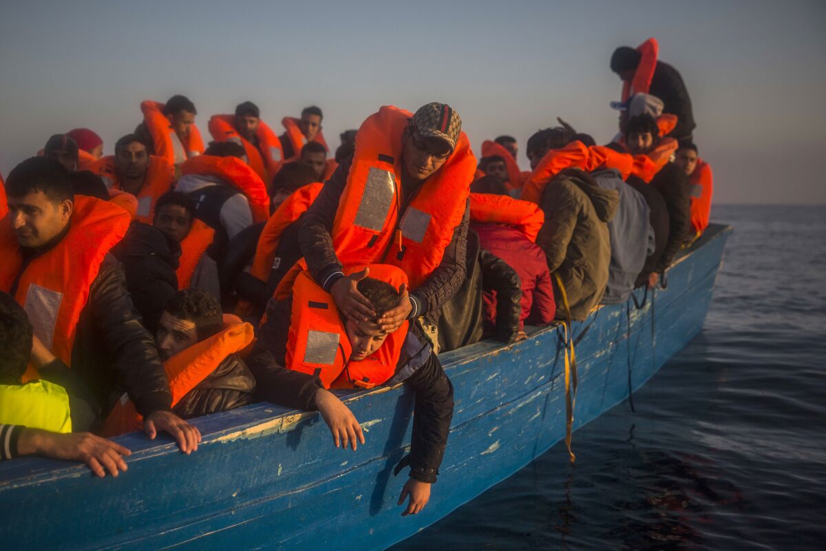 Refugees and migrants on a boat from Libya.
