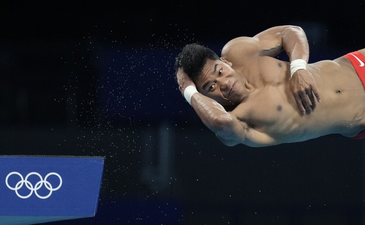 U.S. diver Jordan Windle competes in men's 10-meter platform preliminaries.