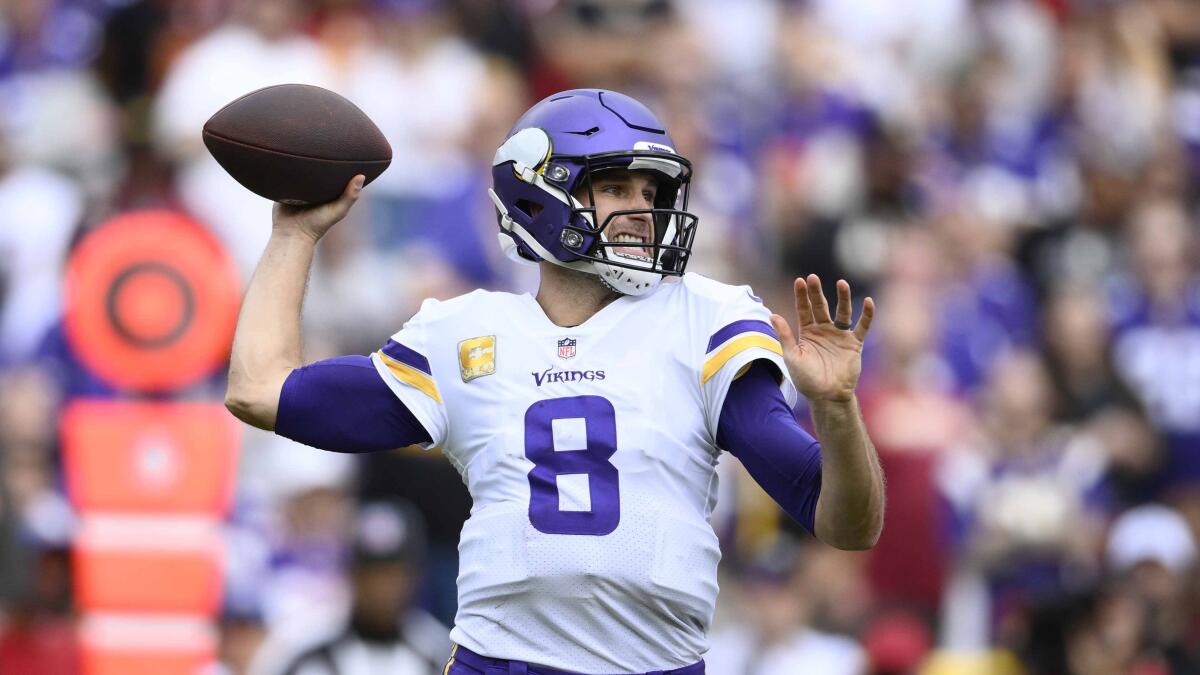 Minnesota Vikings quarterback Kirk Cousins in action during the first half against the Washington Commanders.