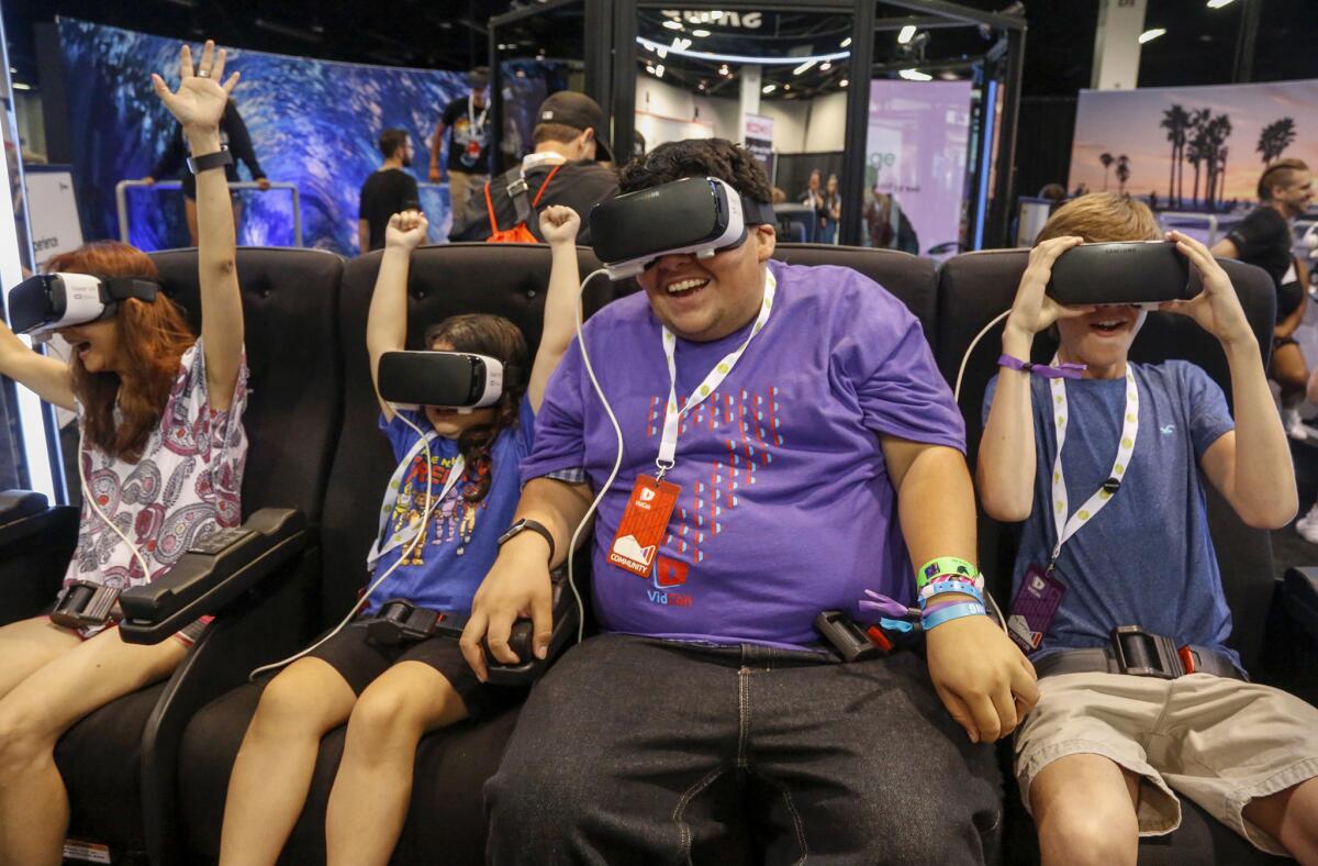 Attendees at the VidCon event at the Anaheim Convention Center in June try out virtual reality headsets.