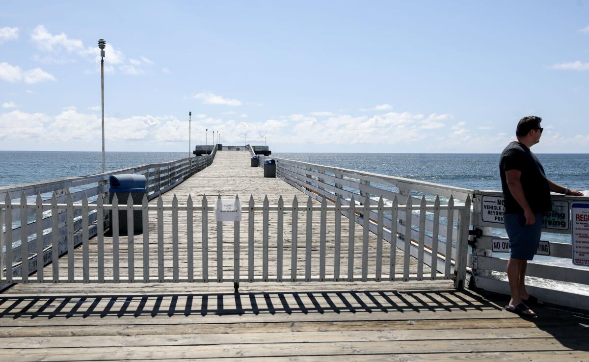 View of Crystal Pier in Pacific Beach. The pier, past the cottages, is closed due to storm damage.