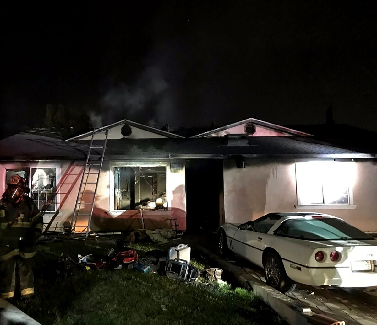 A house in San Jose caught fire Monday night after a man running from police barricaded himself inside, authorities say.