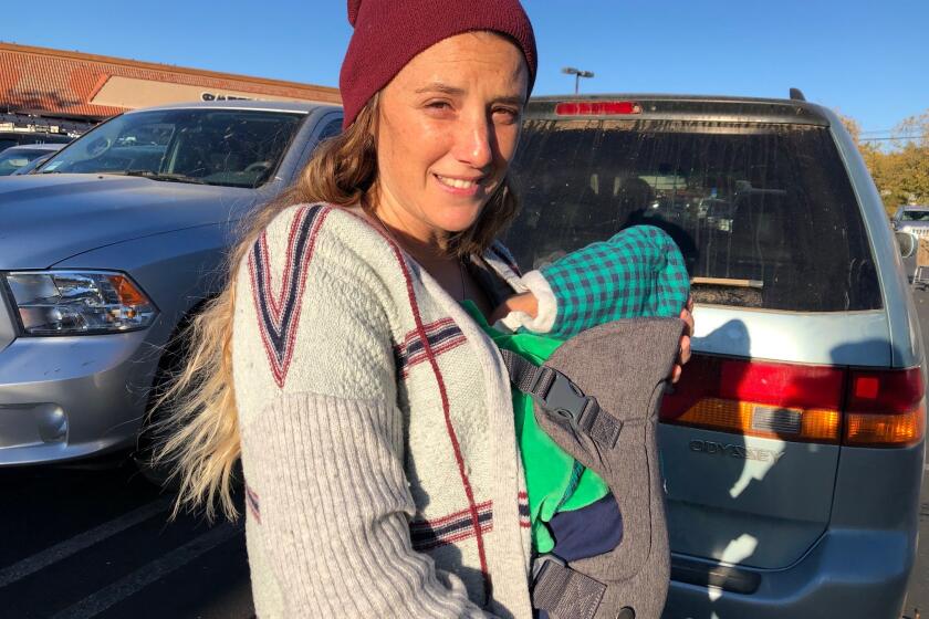 Eliana Rubin with her 3-week old son, James. Rubin has been without power for five days during the PG&E safety shutoff. 