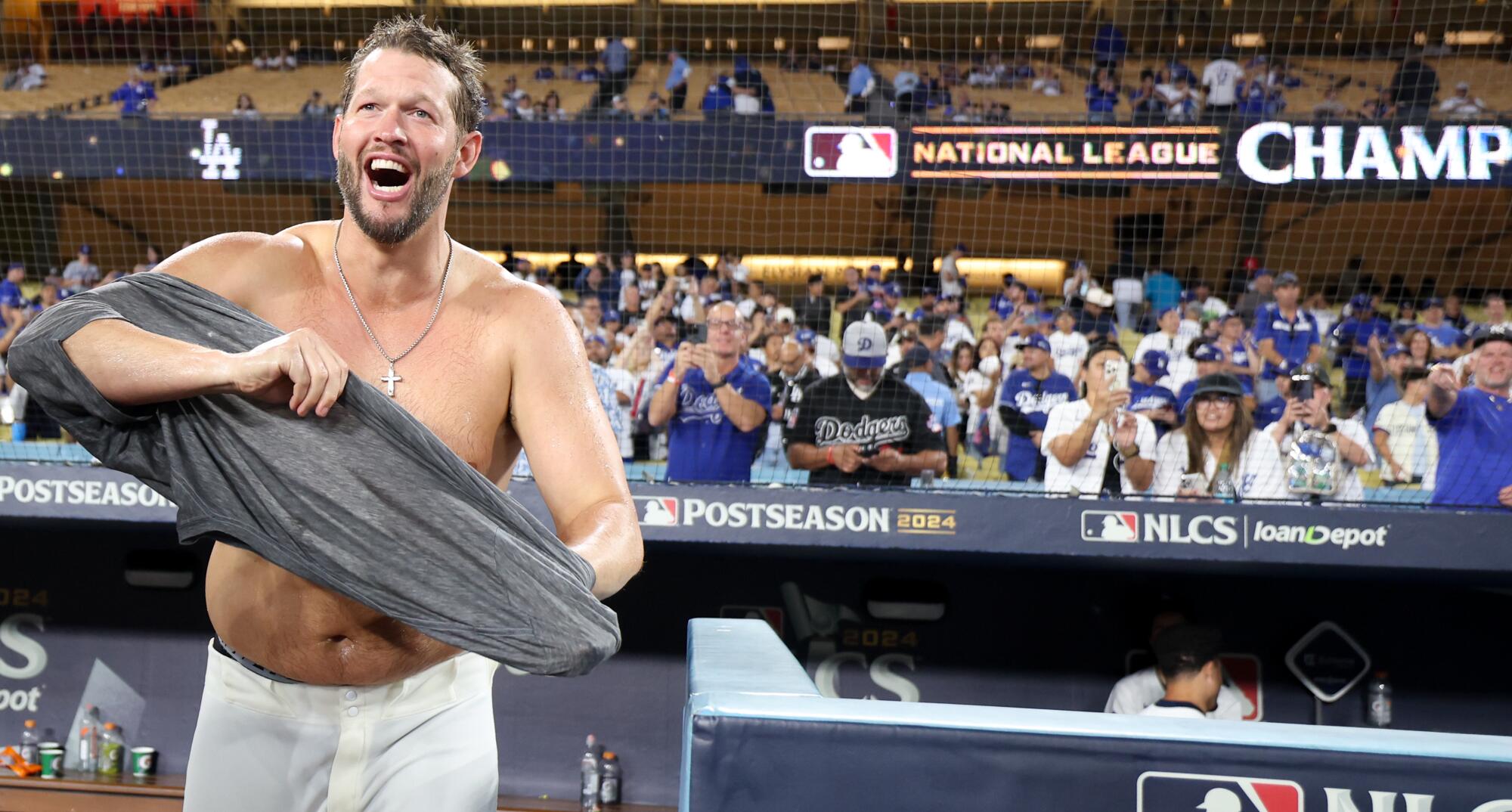 Dodgers pitcher Clayton Kershaw celebrates on the field after the team's win over the New York Mets at Dodger Stadium.