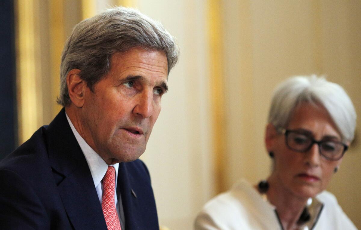 U.S. Secretary of State John F. Kerry and U.S. Undersecretary for Political Affairs Wendy Sherman attend a meeting with the Iranian delegation in Vienna on Saturday. Officials conceded they would miss a self-imposed Tuesday deadline to wrap up the nuclear talks.