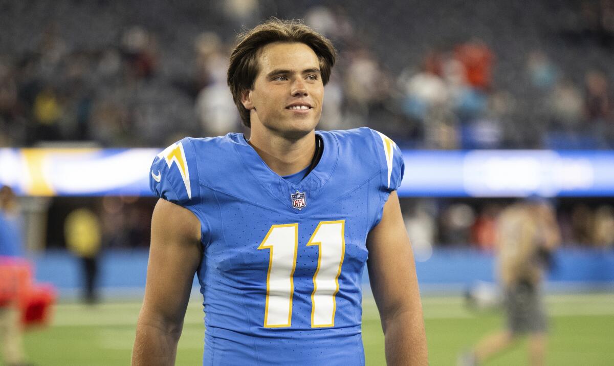 Chargers kicker Cameron Dicker walks back to the locker room after a football game against the Bears.