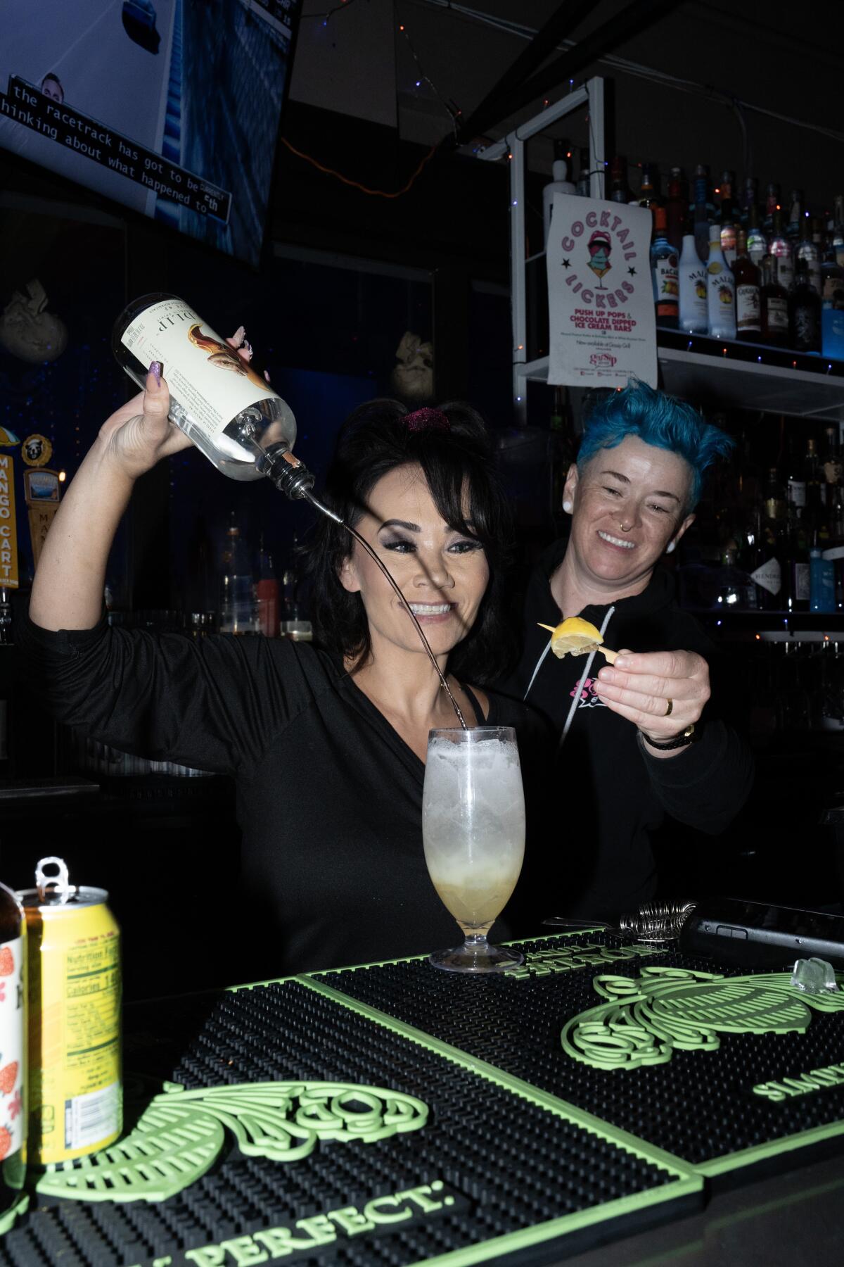 Freda Horton, left, and Lindsey Leavitt prepare one of their non-alcoholic cocktails, "Lady Business." 
