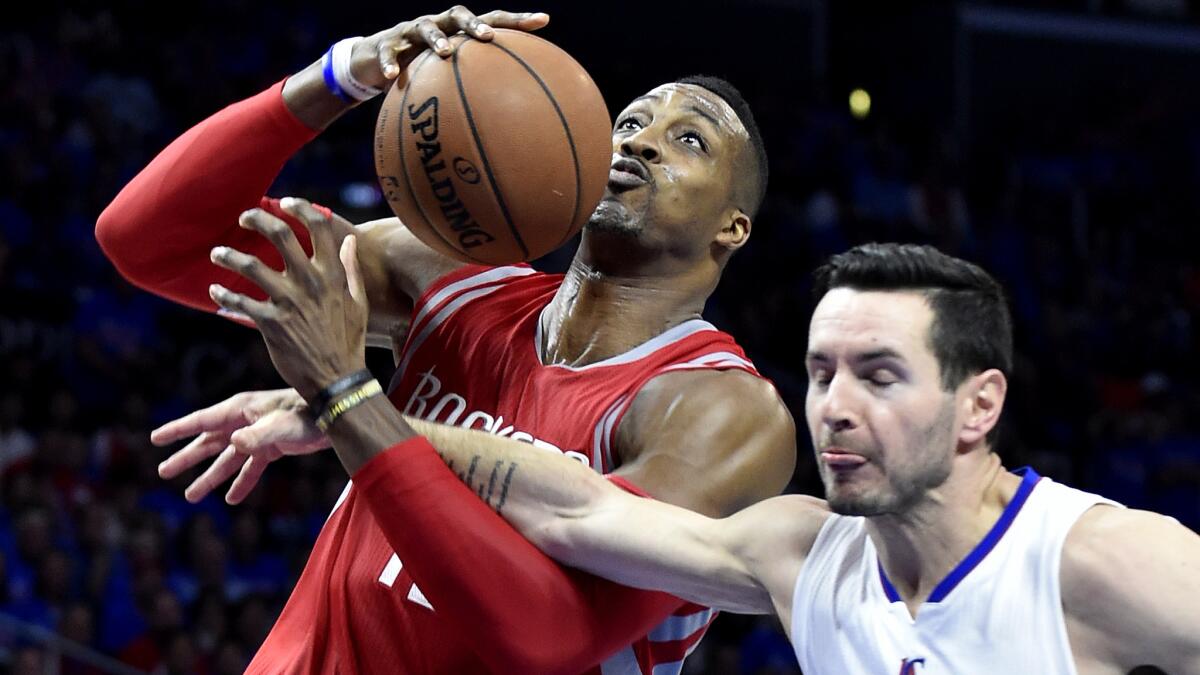 Clippers guard J.J. Redick sends Rockets center Dwight Howard to the free-throw line during Game 6 of their playoff series last spring.