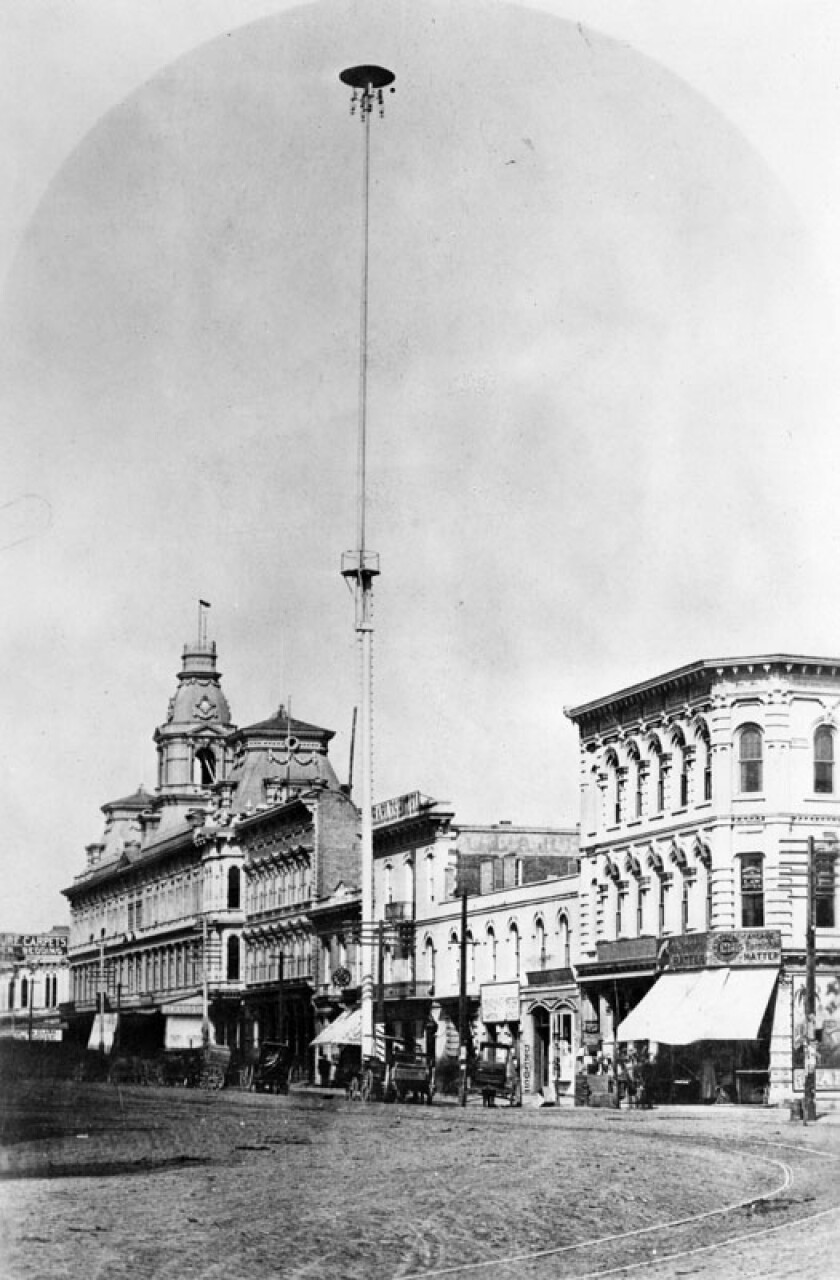 1882 photo showing one of the first seven electric street lights in Los Angeles, standing 150 feet tall.
