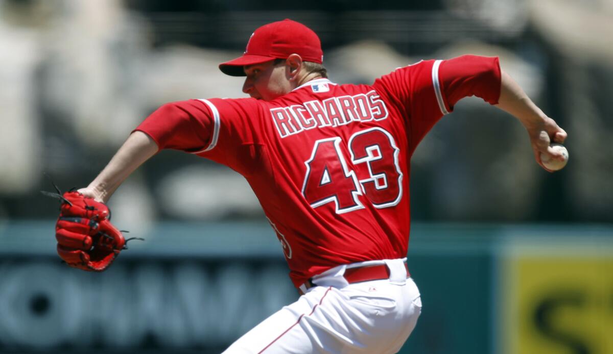 Angels starting pitcher Garrett Richards throws in the first inning against the Twins.