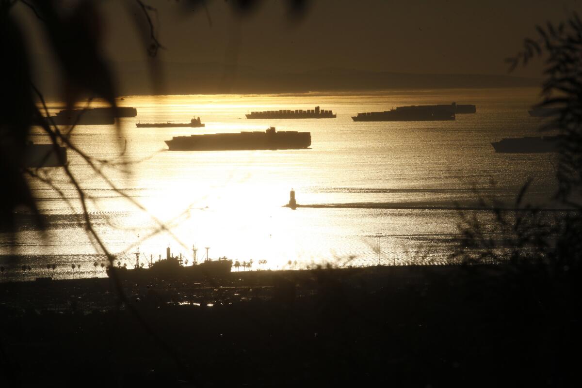 Container ships wait outside the ports of Los Angeles and Long Beach, which are facing increased congestion this President's Day weekend with the unloading of ships halted amid a labor dispute between port employers and the dockworkers union.